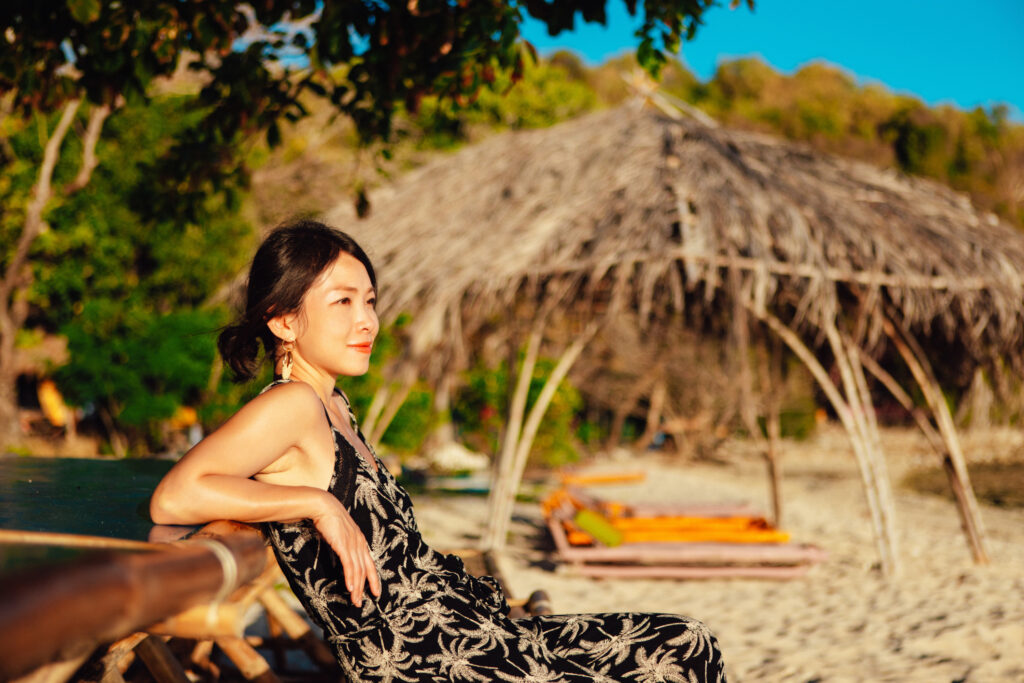 Retire in This Asian Country for a Warm Culture and Relaxed Lifestyle Filipina woman enjoying wellness retreat. Concept of sustainable tourism and eco holiday, or retiring in the Philippines.