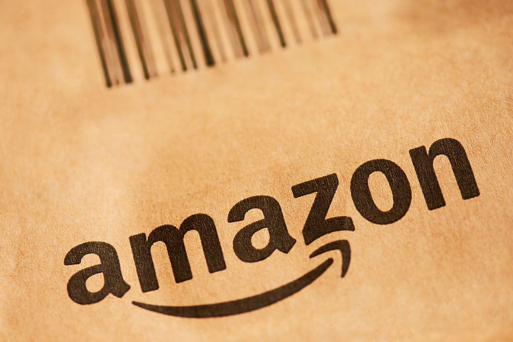 Amazon Ends Prime Invitee Shipping Perk Close up of Amazon logo on box