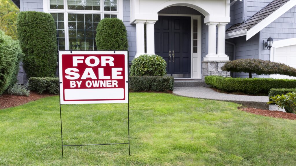 Income Required to Buy a Million-Dollar Home A "for sale by owner" sign in the yard of a home.