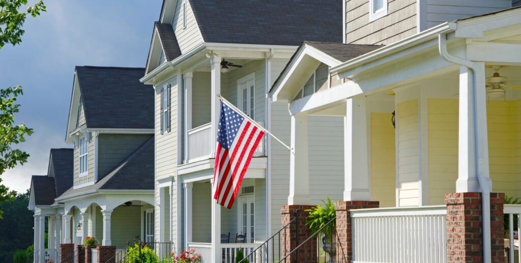 american flag hanging from home