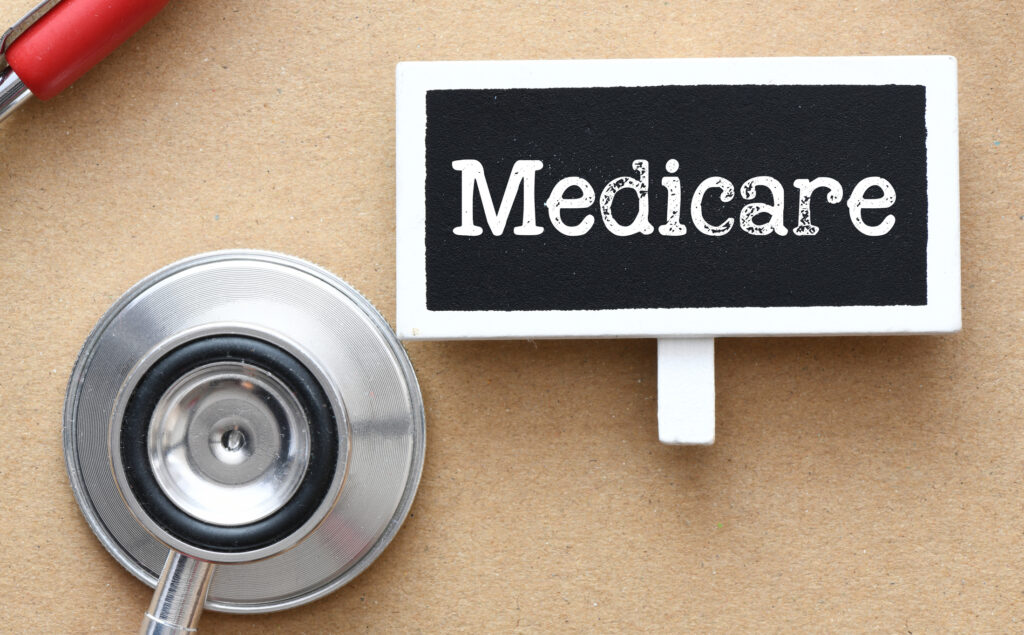 Medicare Prior Authorization Expands to Ambulatory Surgical Centers Medicare word on a small chalk board.