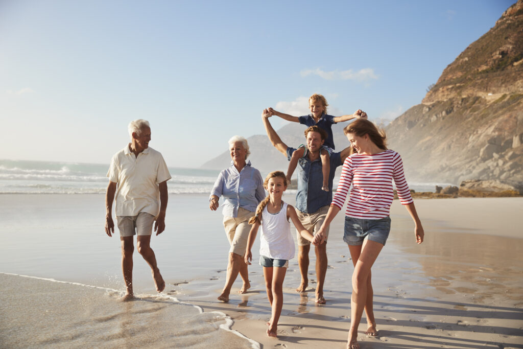 Seven Guilt-Free Ways to Spend Your Retirement Cash Family strolling on a beach