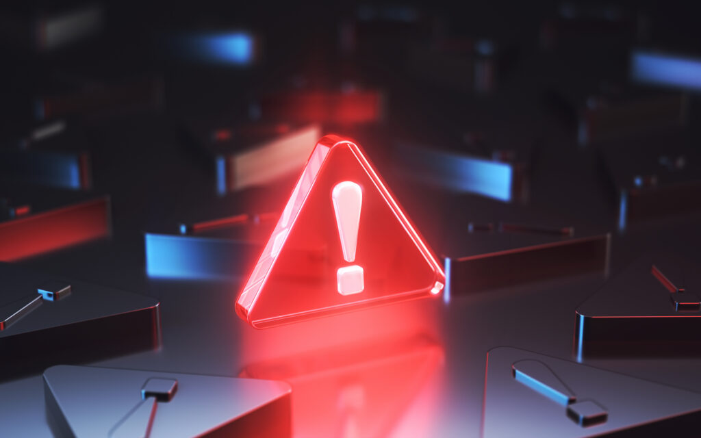What Your Portfolio Says About You and Your Relationship with Risk 3d rendering of a red danger warning triangle sign surrounded by black triangles with exclamation points