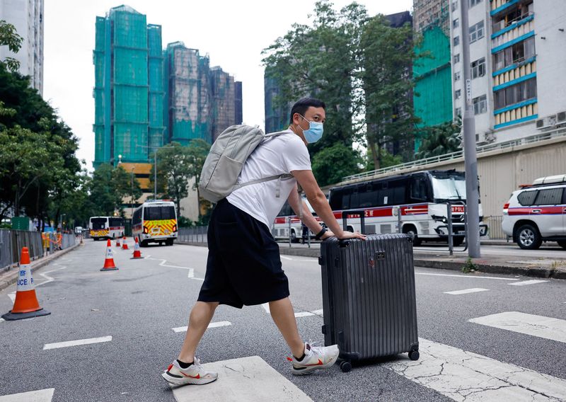 'Highly traumatised': Hong Kong presses ahead with elections after deadly fire