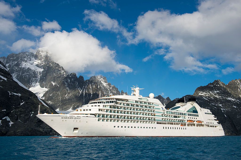 Cruise ship Seabourn Quest cruising in scenic Drygalski Fjord, South Georgia.
