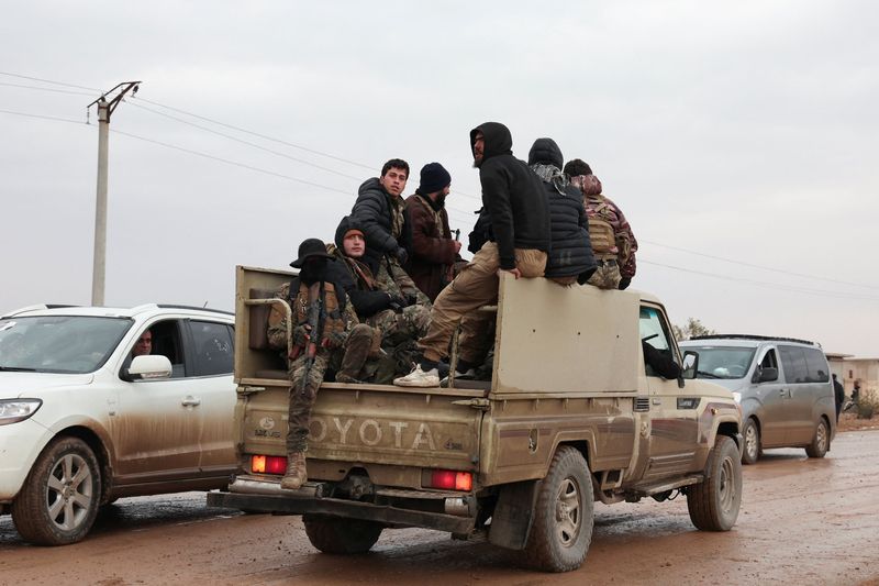Syrian troops sweep northern towns as Kurdish fighters withdraw